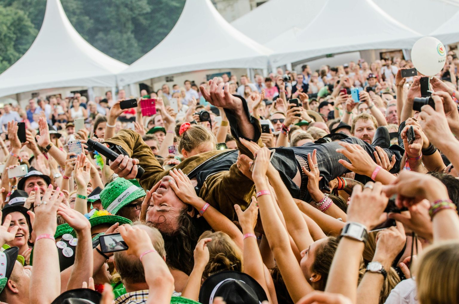 Crowd surfing man attending Sziget Festival in Budapest Hungary